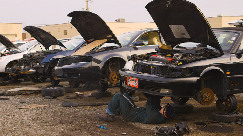 Me yanking the front-mounted turbo out of a Saab 9-3 convertible. Photo: Jared Auslander